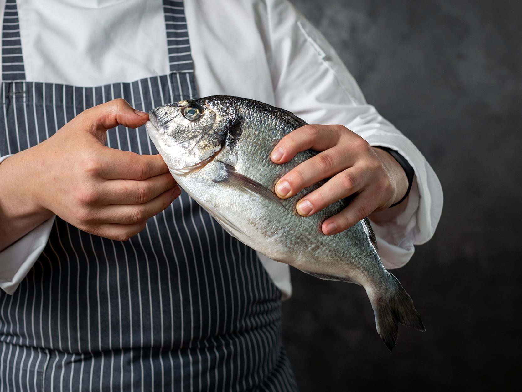 chef holding a fish