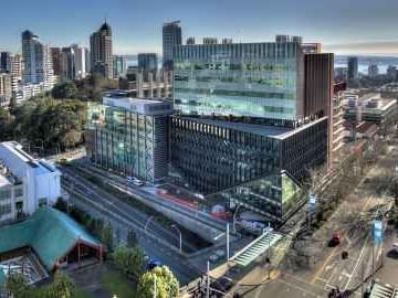 Distant exterior view of University of Auckland, Nesuto Hotels