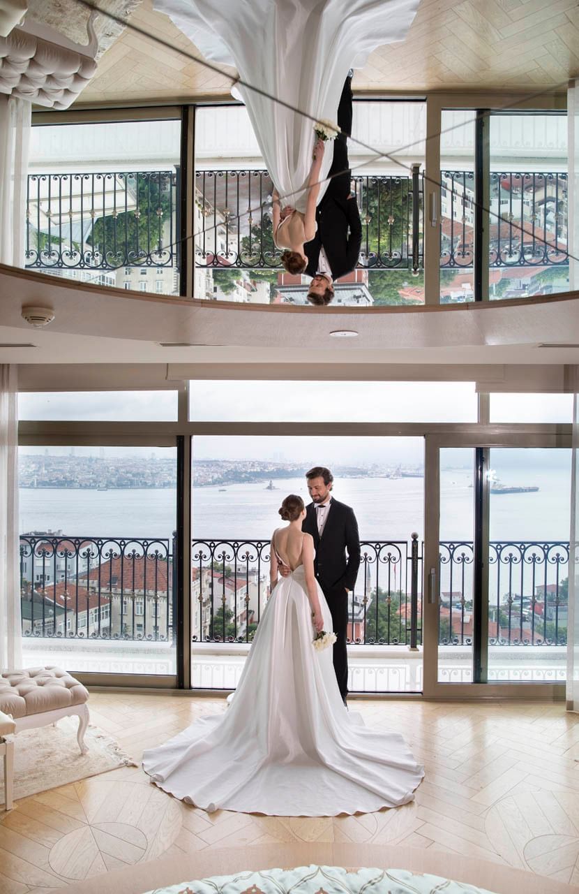 Wedding couples by a balcony at CVK Park Bosphorus Hotel