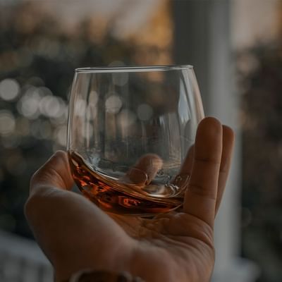 Holding a whisky glass, Whisky distillery, Falkensteiner Hotels