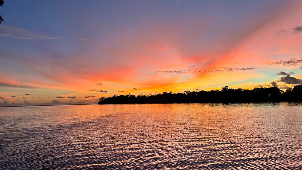 Sunset over water at Warwick Le Lagon - Vanuatu in Efate.