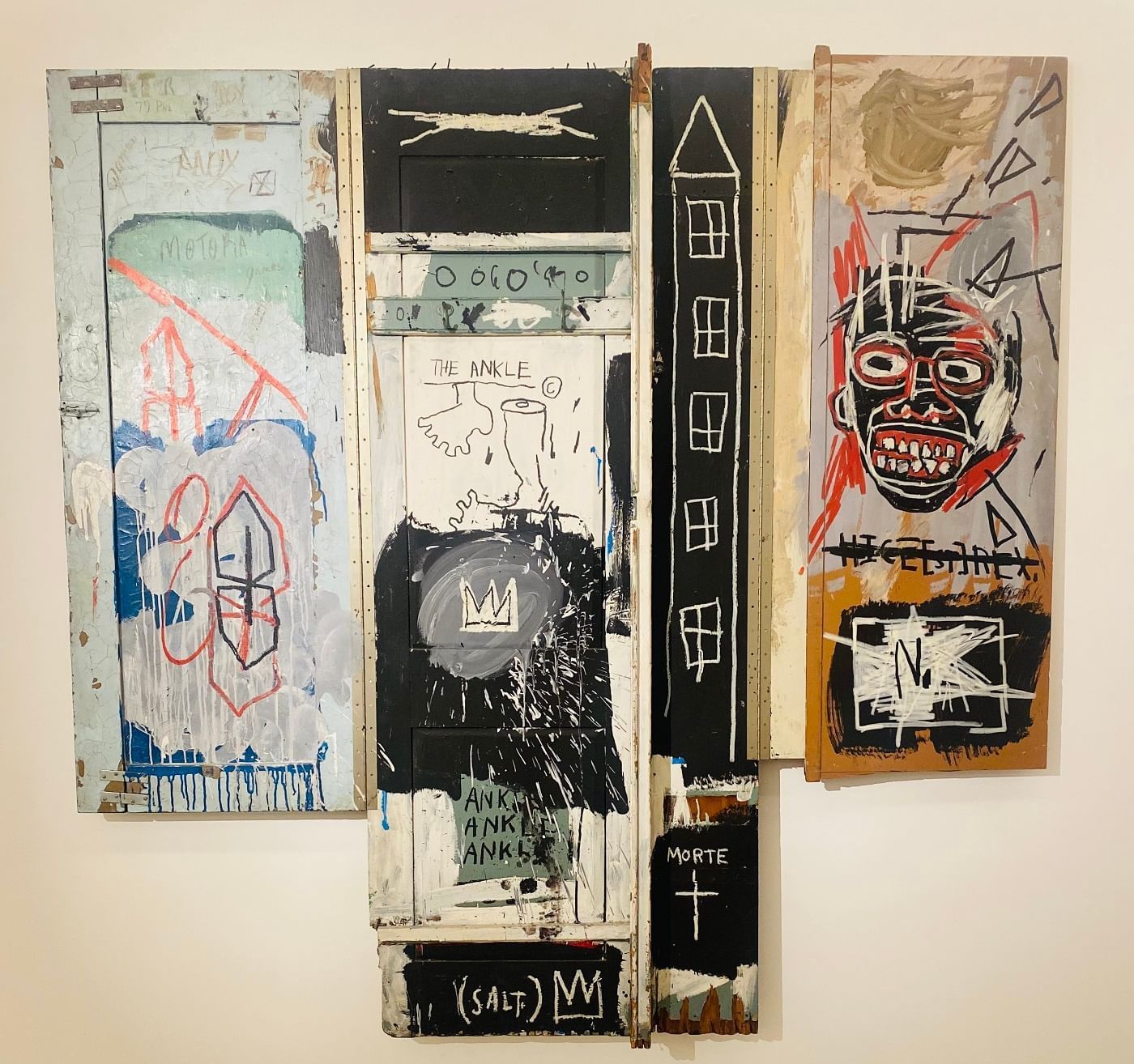 Artwork on multiple panels, featuring figures, text and crowns, displayed in Emma Maud gallery near The Londoner Hotel