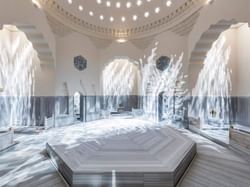 The main chamber of Zeyrek Çinili Hamam, featuring intricate tilework and a central marble platform.