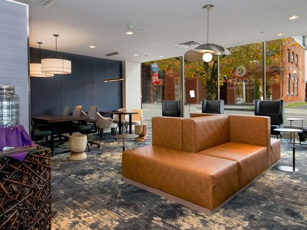 Guest lounge with cozy seating and beverage station