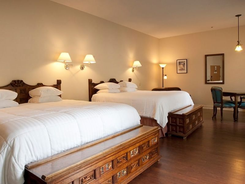 King beds in Double King Room with Courtyard at La Tourelle Hotel and Spa