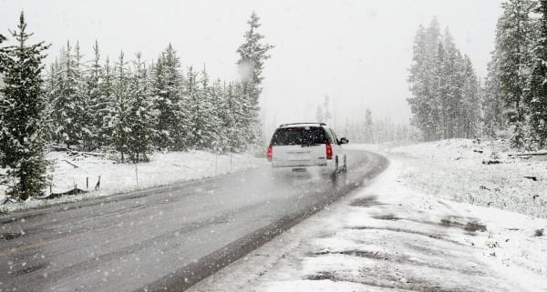 An important holiday travel tip for winter road trips is to get an oil change and a tune-up before you hit the road. 