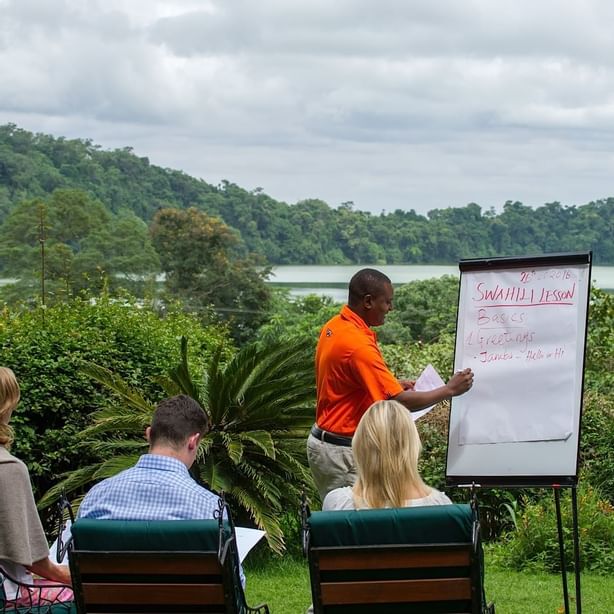 A person giving Swahili Lessons at Arusha Serena Hotels
