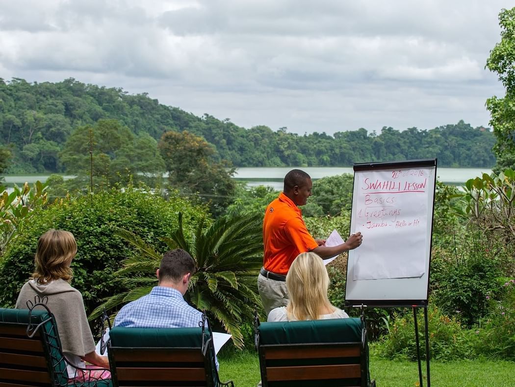 A person giving Swahili Lessons at Arusha Serena Hotels