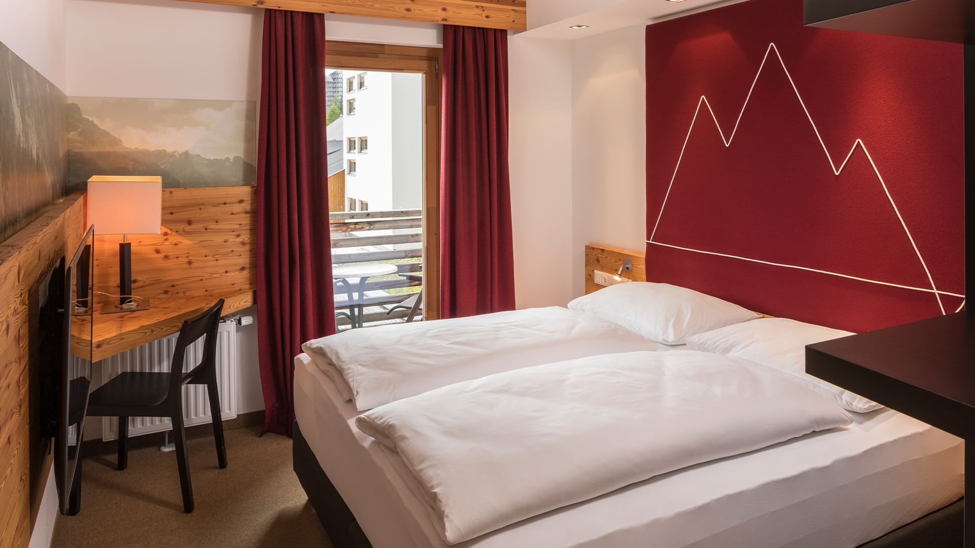Comfy bed in Comfort Room At Falkensteiner Hotels
