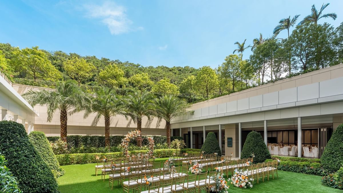 Outdoor wedding chair set-up with flower decorations in The Courtyard at Ocean Park Hotel Hong Kong