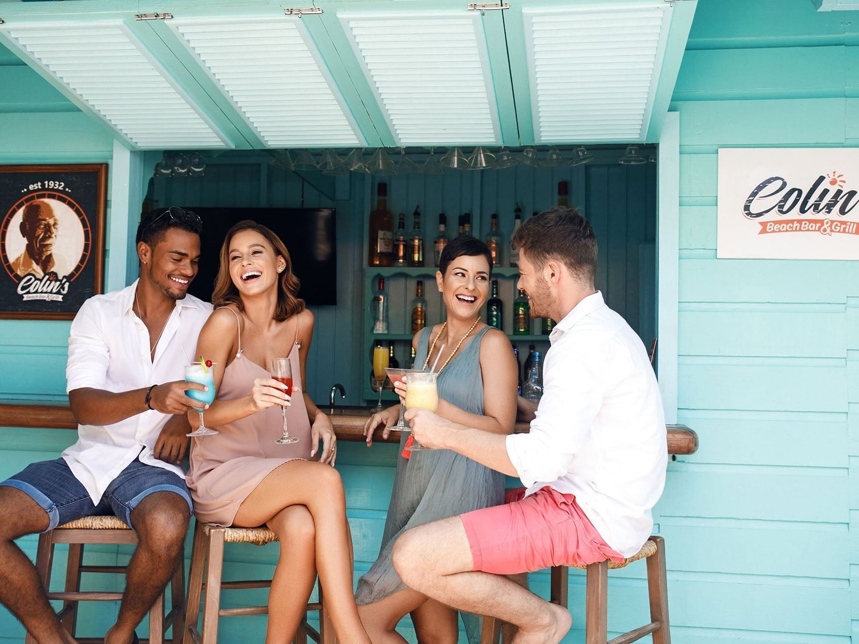 Couples having cocktails in Colin's Bar at Sugar Bay Barbados