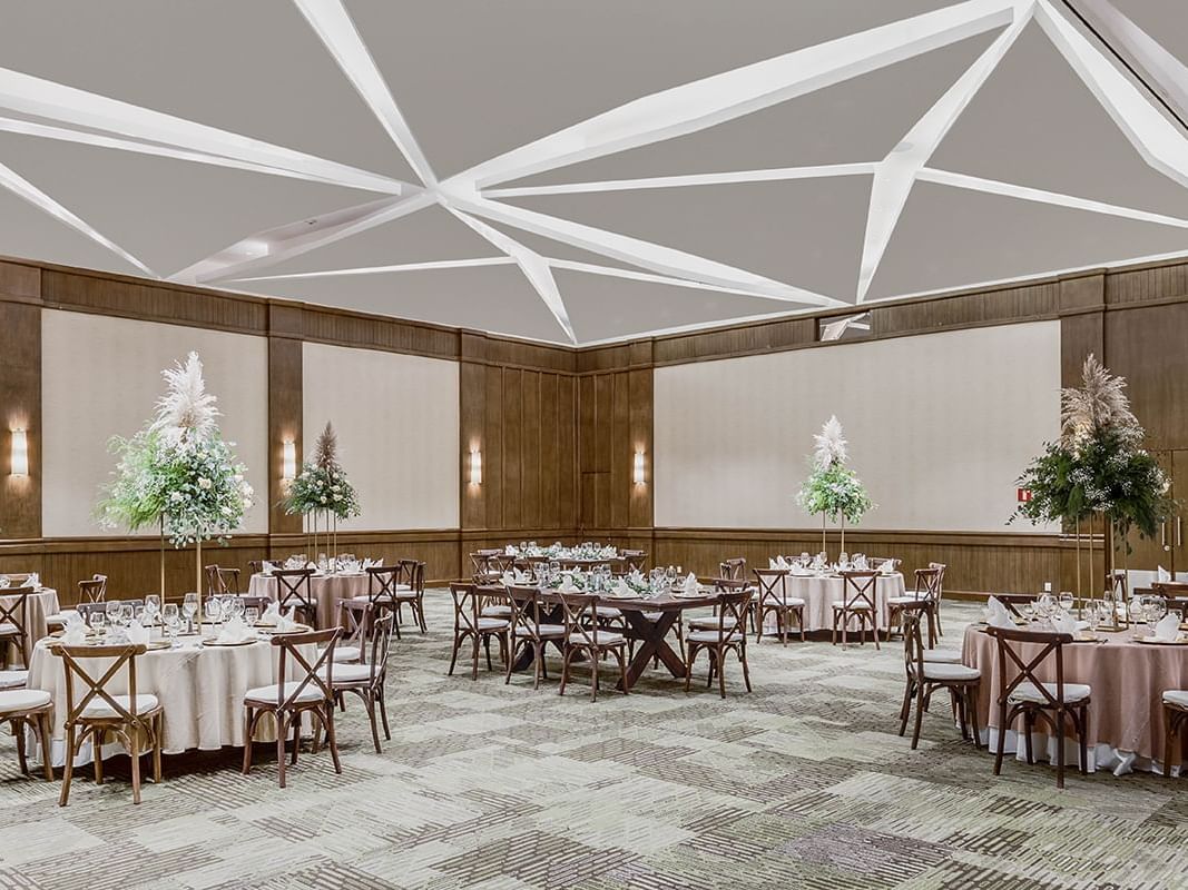 Banquet tables arranged in Flowers at Fiesta Americana Hotels