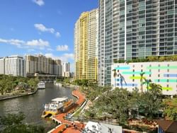 aerial shot of river and hotel