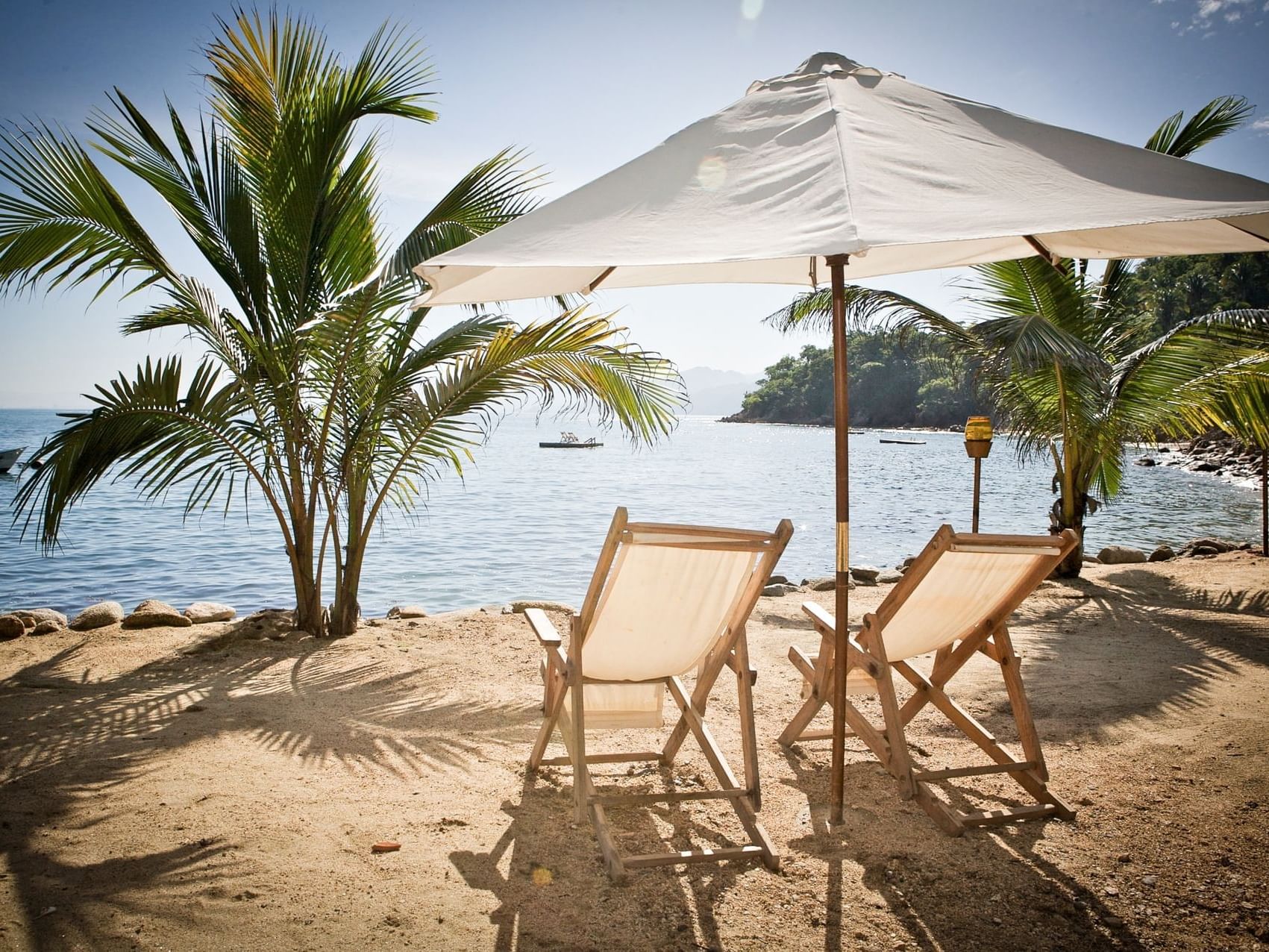 Two beach chairs in Caletas Beach Vallarta near Plaza Pelicanos Grand Beach Resort