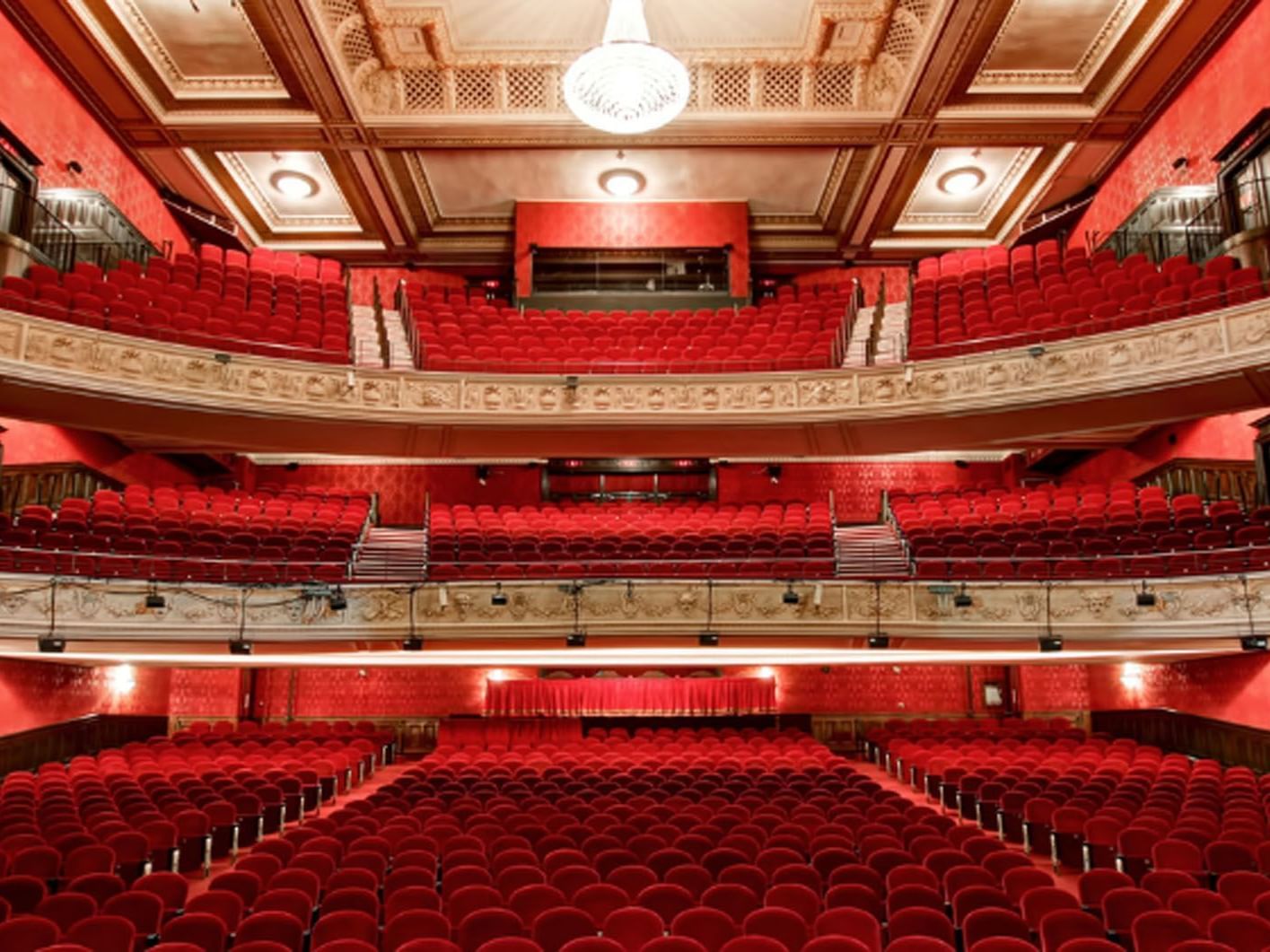 The Royal Alexandra Theater with multiple seating levels and a central chandelier near Hotel X Toronto