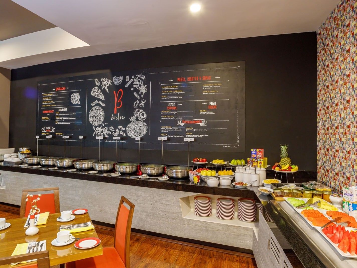 Breakfast buffet in Bistro featuring fresh fruit, cereal, and a chalkboard menu at Camino Real Pachuca