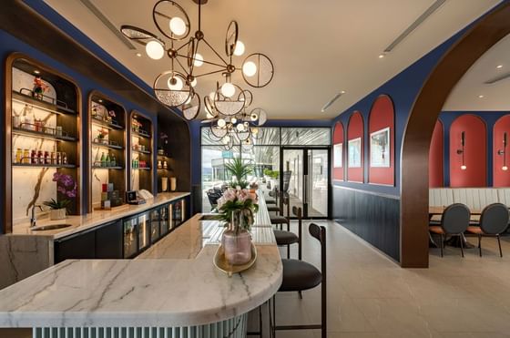 Spacious Poolside Bistro with arranged chairs at Imperial Lexis Kuala Lumpur