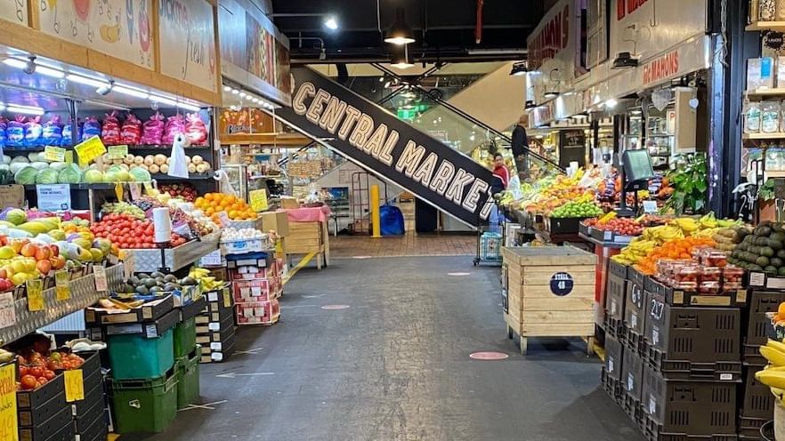 Central Market featuring fresh produce stalls and a prominent Central Market sign near Ibis Adelaide