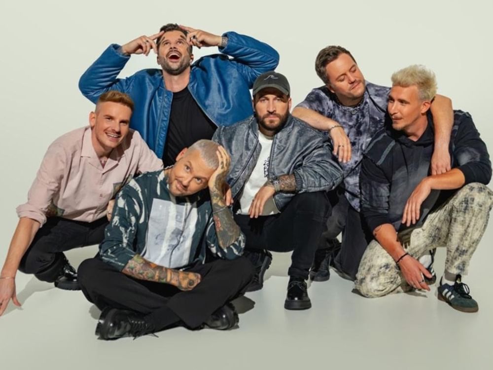 Electric Callboy band members posing together for a promotional photo.