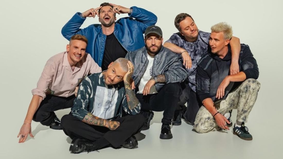 Electric Callboy band members posing together for a promotional photo.