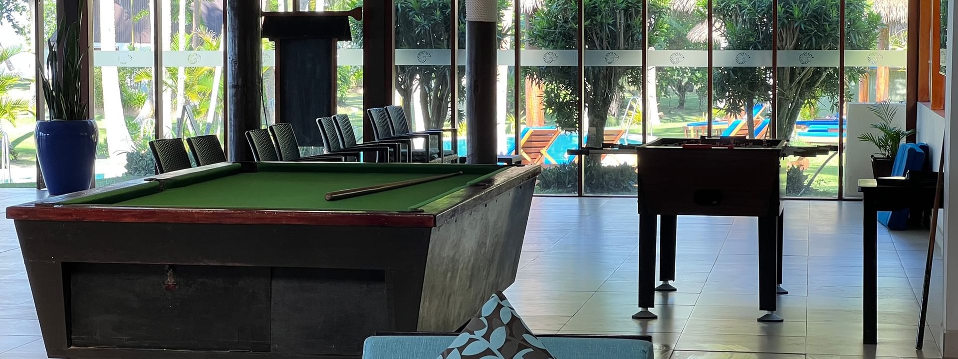 Indoor recreation area with pool tables at Tambua Sands Beach Resort in Sigatoka