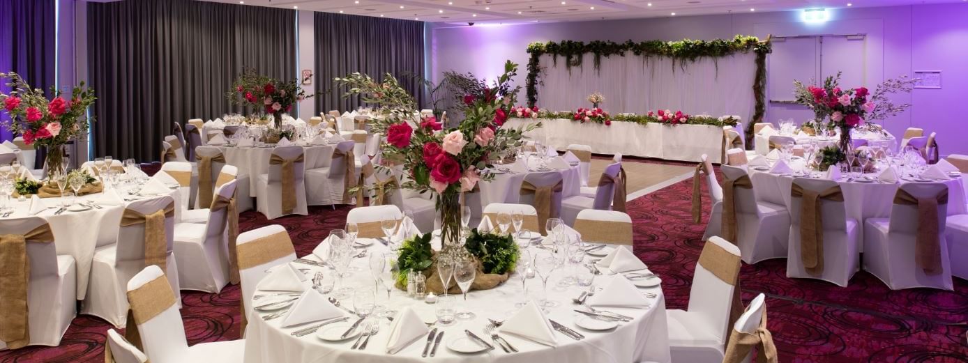 Banquet tables setup in a ballroom for event at Novotel Sydney 