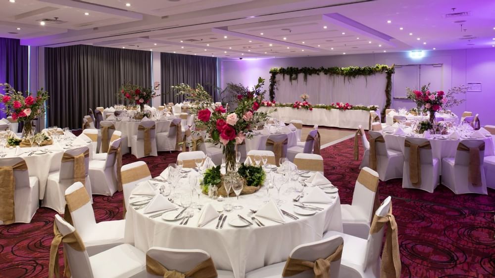 Banquet tables setup in a ballroom for event at Novotel Sydney 