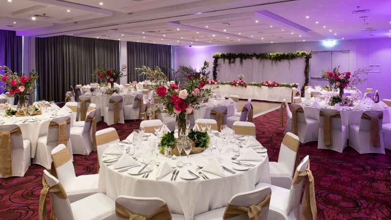 Banquet tables setup in a ballroom for event at Novotel Sydney