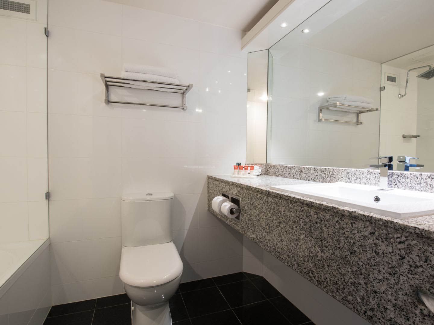 Bathroom lavatory by the vanity in Executive Twin Room at Grand Chancellor Adelaide