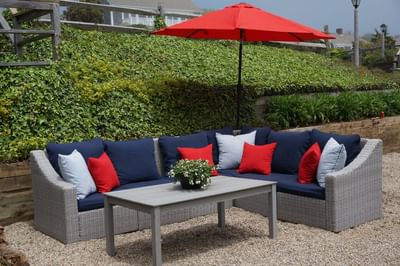 Outdoor sofa with comfy pillows, canopy & coffee table at Chatham Tides Resort