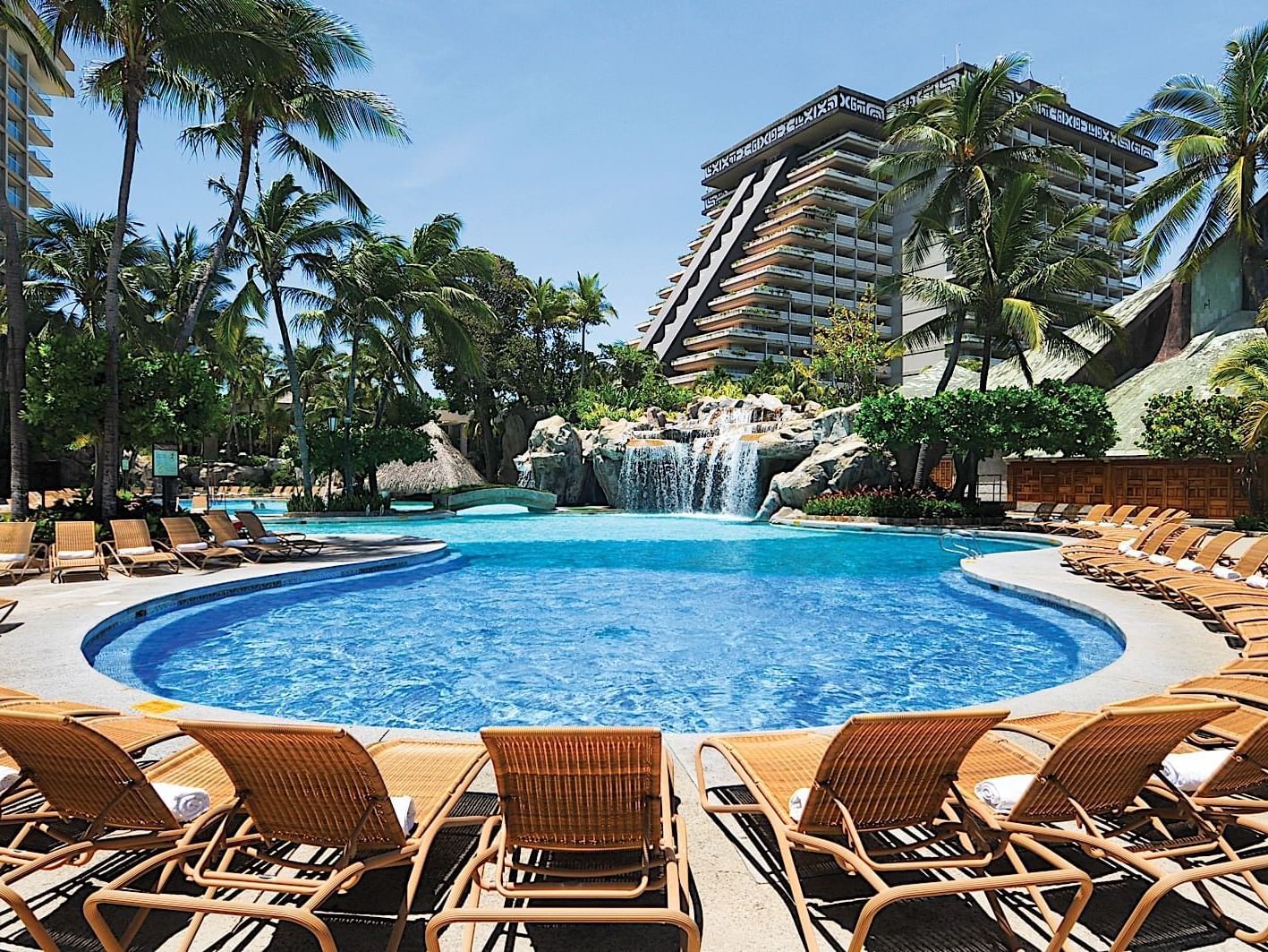 Outdoor pool with hotel exterior at Princess Mundo Imperial