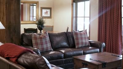 Loune area with plush seating by the window in the Presidential & Penthouse Suites at Hotel Park City Autograph Collection