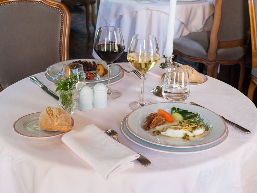 Wine & dishes served in a Restaurant at Chateau du Landel