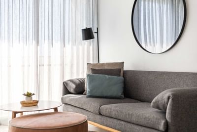 Living area with sofa in One Bedroom Apartment at Alcyone Hotel Residences which supplies accommodation in Hamilton Brisbane