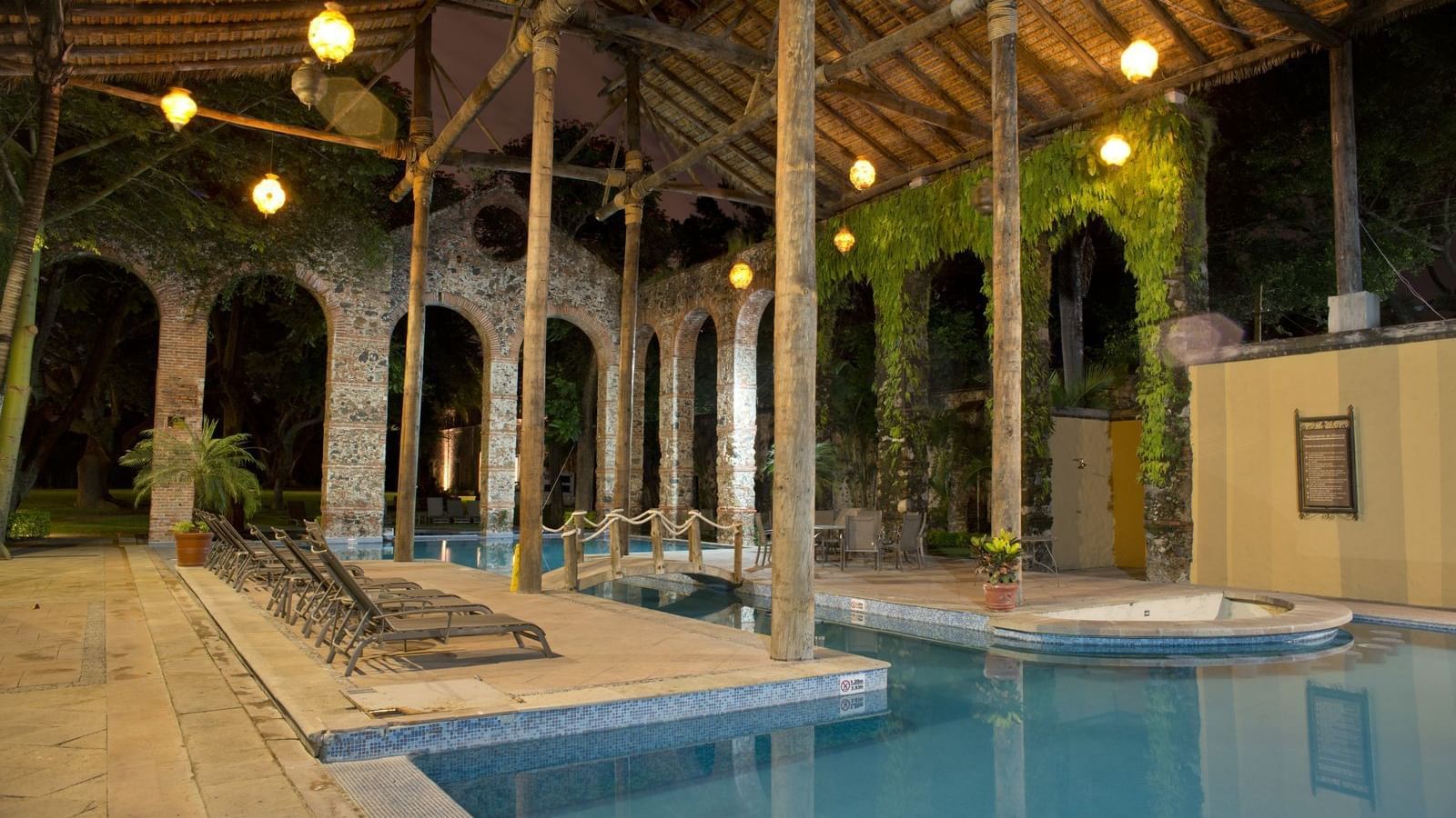 Indoor Pool with pool beds at FA Hacienda San Antonio