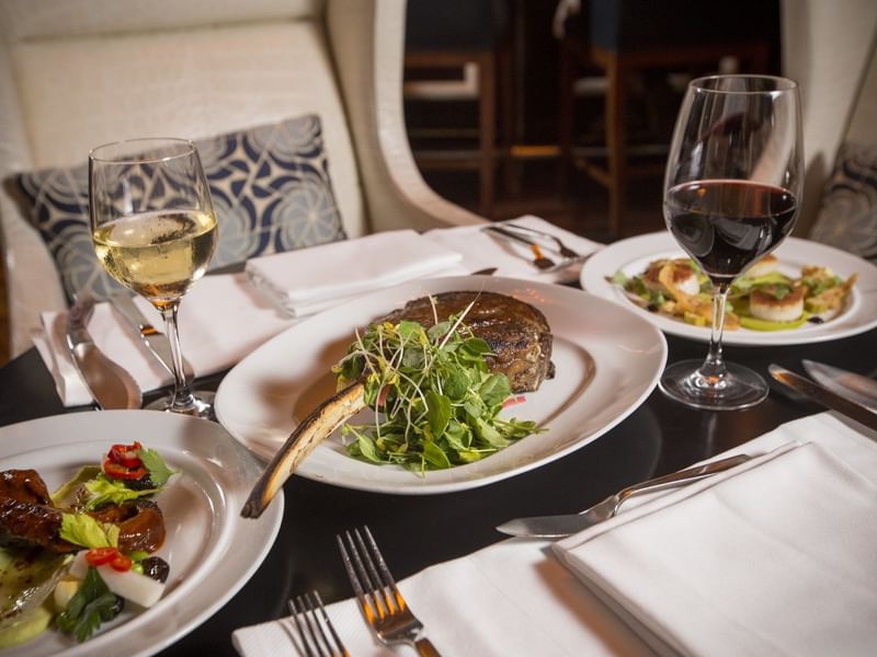 3 fine dining dishes served with drinks at The Diplomat Resort