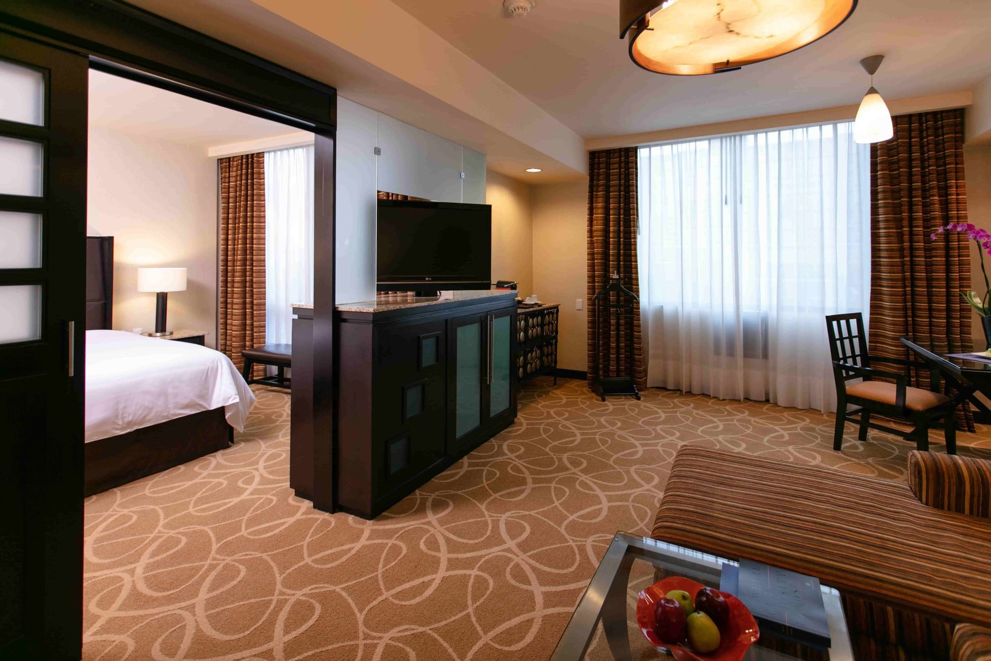 An image depicting the interior of one of our rooms, with a spare room with a TV for a pleasant stay of our guests.
