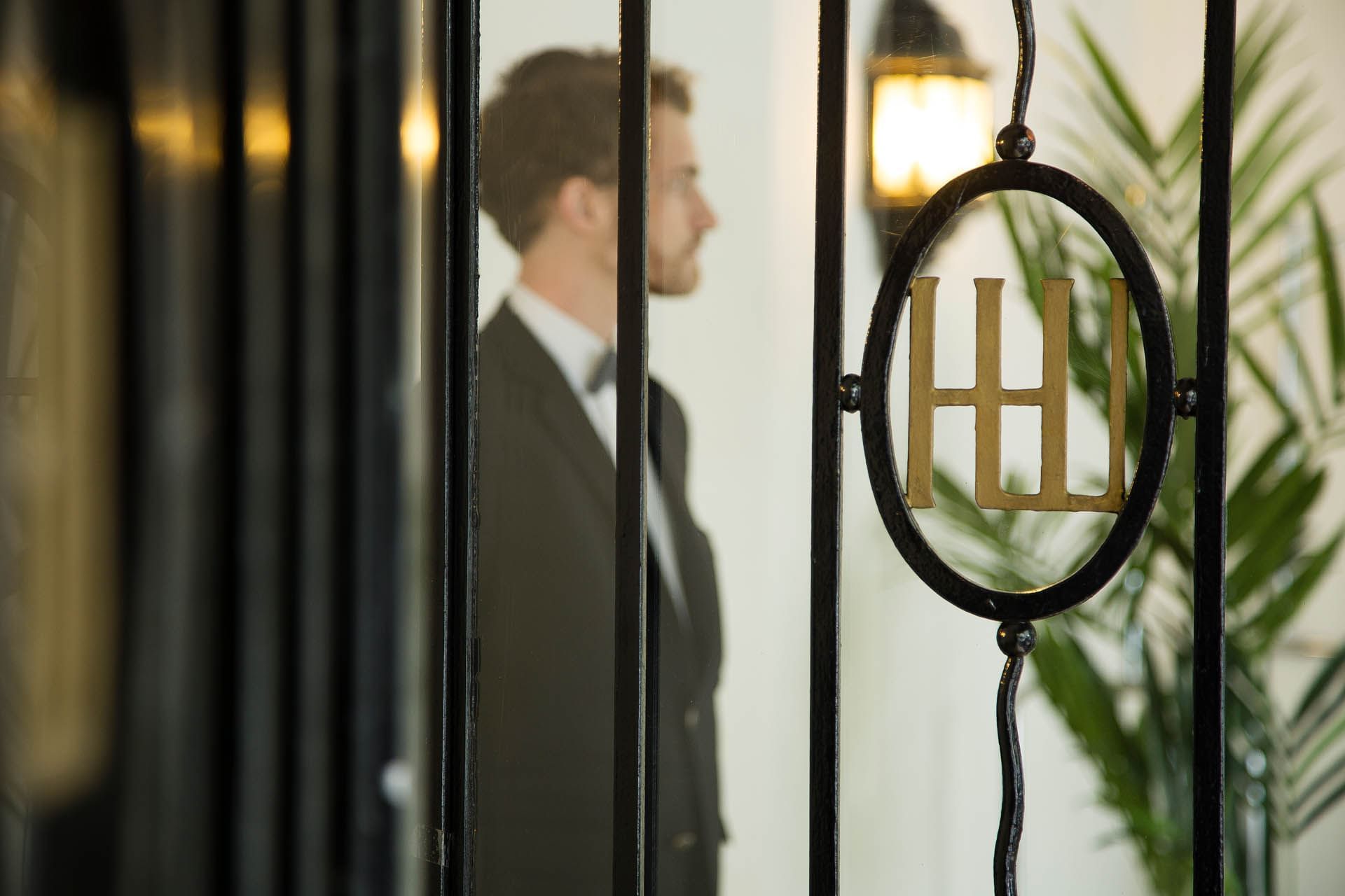 Receptionist stood up in lobby area at Oceania L'Univers Tours