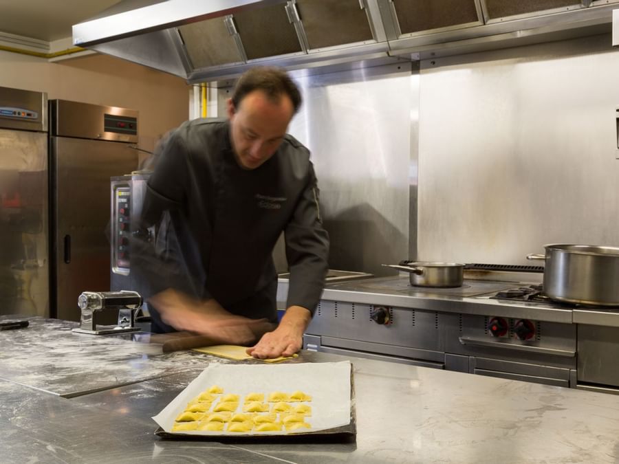 A chef making cookies with a dough at Hotel eclipse