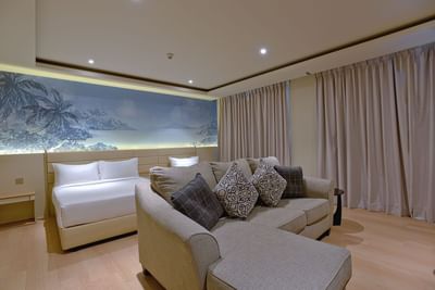 Seating area by the bed in Family Suite at Cititel Express Kota Kinabalu