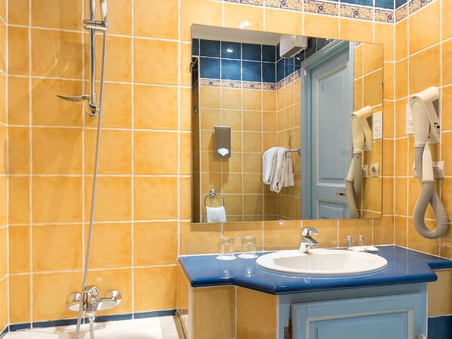 Bathroom vanity in bedrooms at Hotel des Orangers