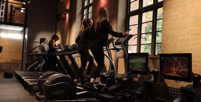 Four ladies on treadmills facing outside at East Park Gym