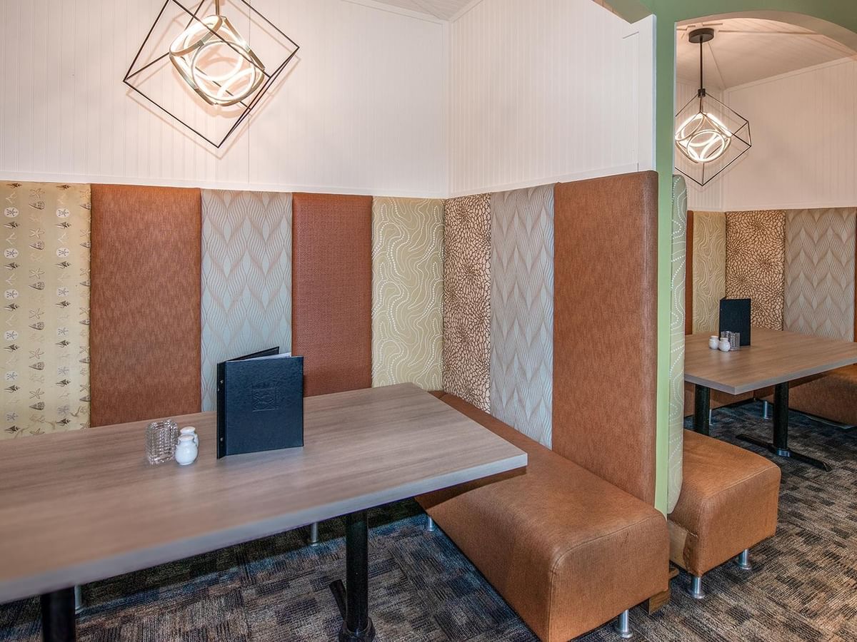 Two tables with patterned backrests at Minnoz Restaurant + Lounge, Coast Bastion Hotel in Nanaimo.