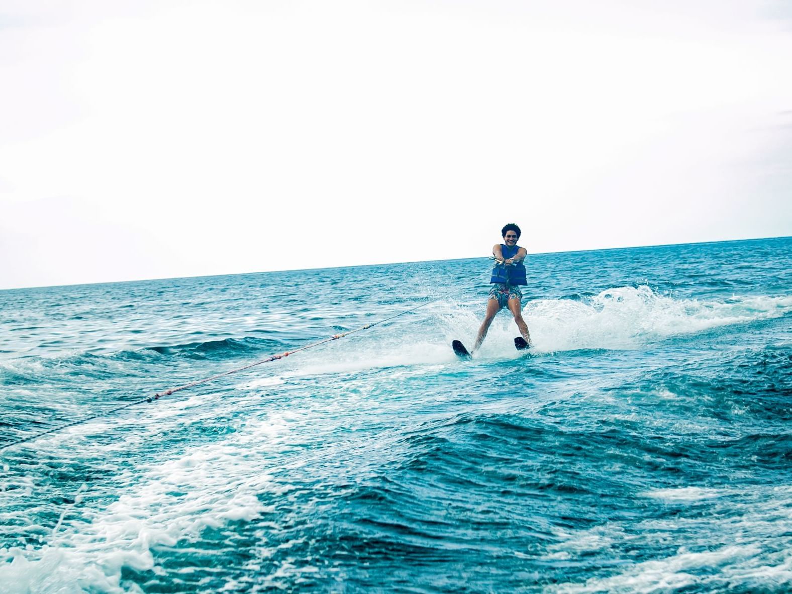 Man experiencing wakeboarding with Captain's Watersports on the sea near Holiday Inn Montego Bay