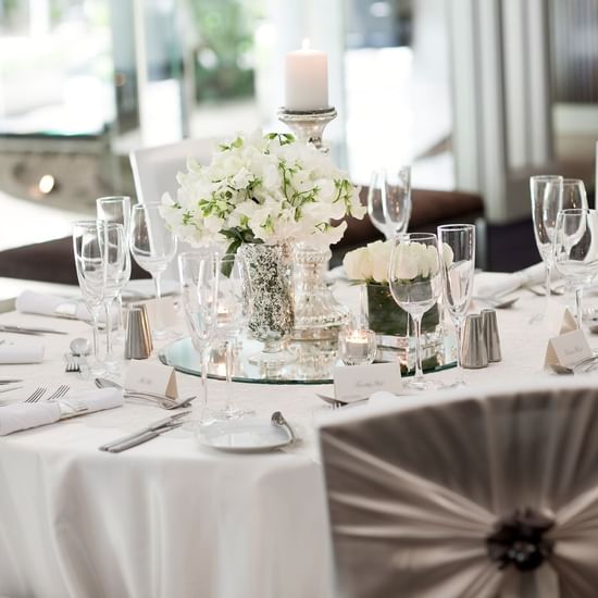 Banquet table arrangement with flower décor in a Ballroom at Pullman Sydney Hyde Park