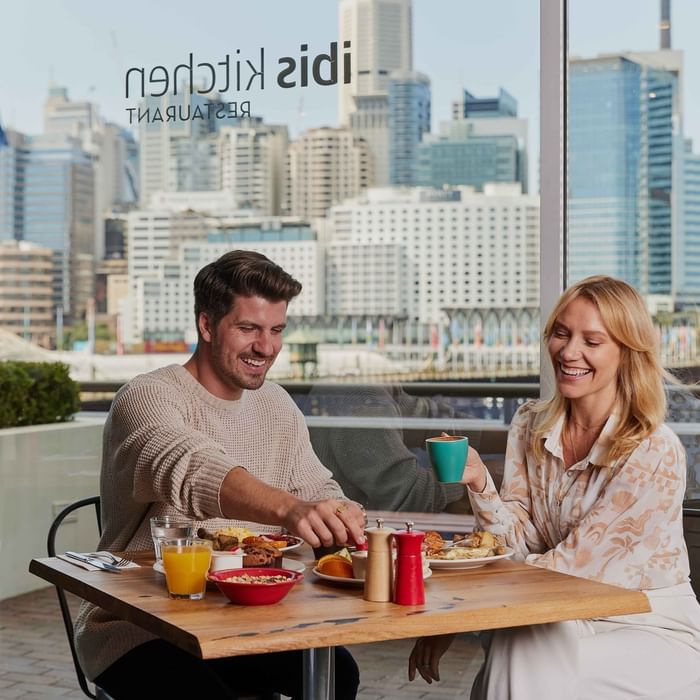 Couple eating breakfast at ibis restaurant