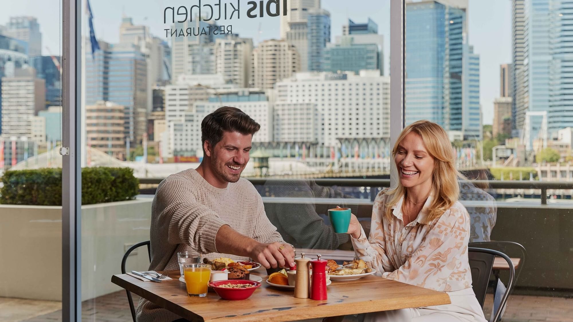 Couple eating breakfast at ibis restaurant
