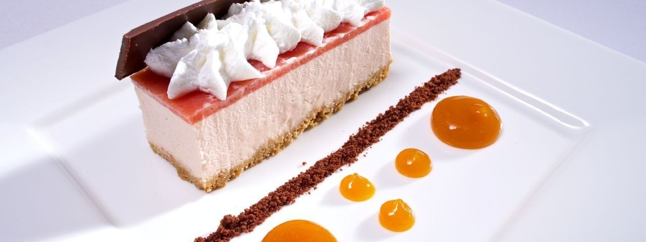 Cheesecake with fruit gel under whipped cream in Abbiocco at Warwick Paradise Island Bahamas