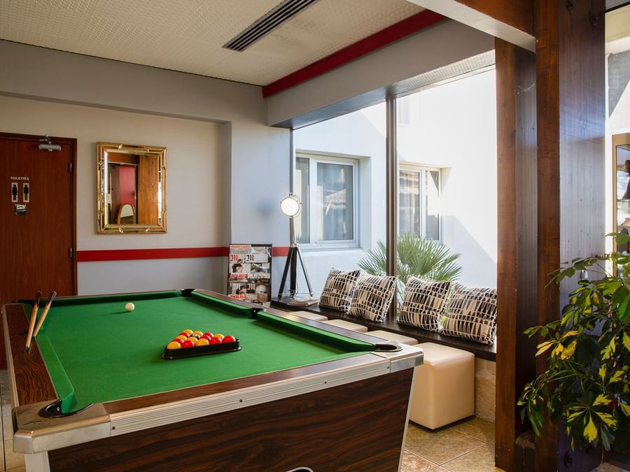 Wooden interior billiard room in Hotel Aquilon