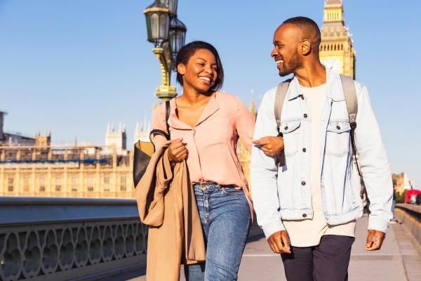 Married couple strolling through the streets of London on their second honeymoon in the UK